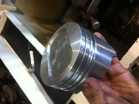 1990 Ford Bronco - A close-up of a metal piston, part of a "351w build" engine project.