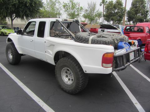 1964 Ford Ranchero - This modified pickup truck is equipped for off-road adventures with large tires and extra fuel.