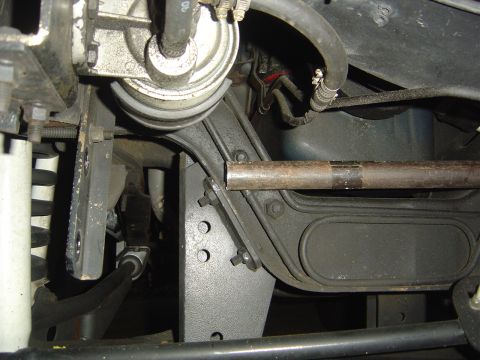1986 Ford Bronco - Underside view of a vehicle's steering and suspension system, focusing on the bracketry.