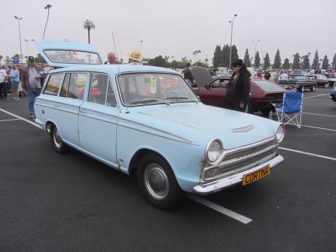 1964 Ford Ranchero - Light blue station wagon, possibly a Ford Cortina, parked at an outdoor event.