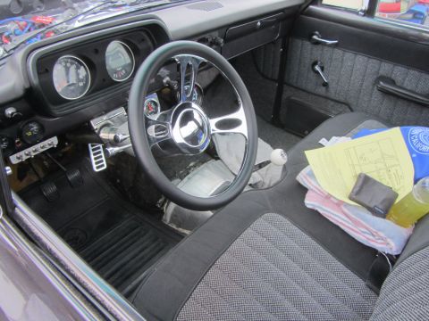 1964 Ford Ranchero - Interior of a 1964 Ford Ranchero, an aftermarket steering wheel and custom seat covers.