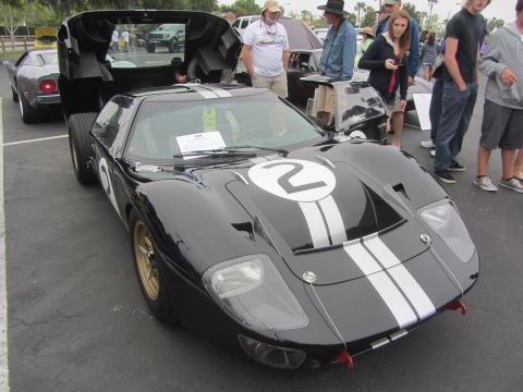 1964 Ford Ranchero - A black Ford GT40 with racing stripes and the number 2 is displayed with its doors open.