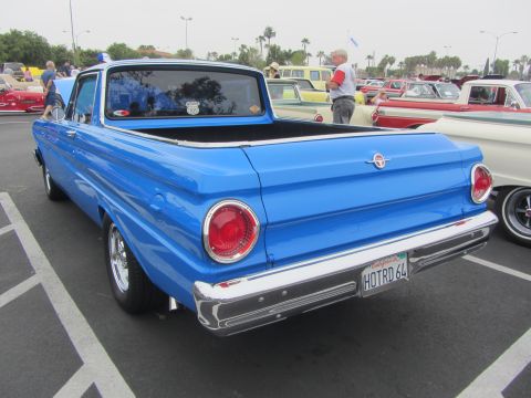1964 Ford Ranchero - Rear view of a blue 1964 Ford Ranchero at a car show with other vehicles present.