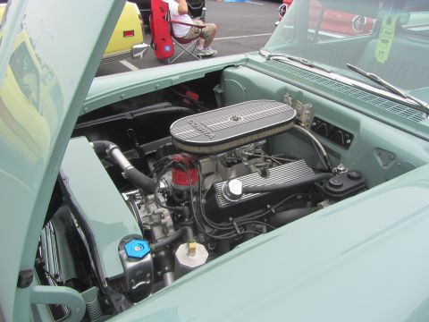 1964 Ford Ranchero - Close-up of a car's engine bay, showing the V8 engine and air cleaner assembly.
