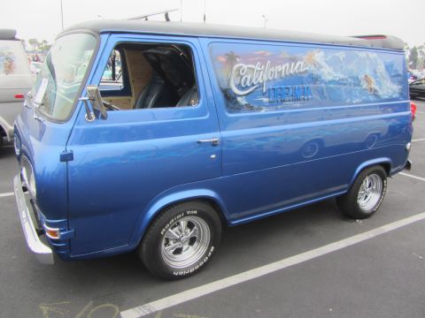 1964 Ford Ranchero - This van features a custom mural depicting a surf scene with the words 'California Dreamin''.