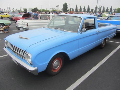 1964 Ford Ranchero - A light blue 1963 Ford Falcon Ranchero is parked in a lot with other vehicles visible.
