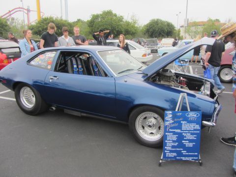 1964 Ford Ranchero - A blue 1971 Ford Pinto is displayed with its hood open, revealing the engine and racing seats inside.