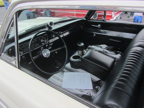 1964 Ford Ranchero - Interior view of a 1964 Ford Ranchero, showing the dashboard, steering wheel, and seats.