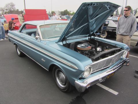 1964 Ford Ranchero - A light blue 1964 Ford Ranchero is displayed with its hood open at a car show.
