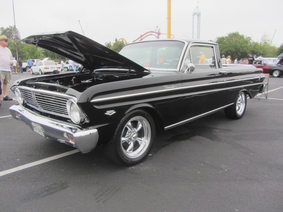 Black 1963 Ford Falcon Ranchero with hood open, parked outside