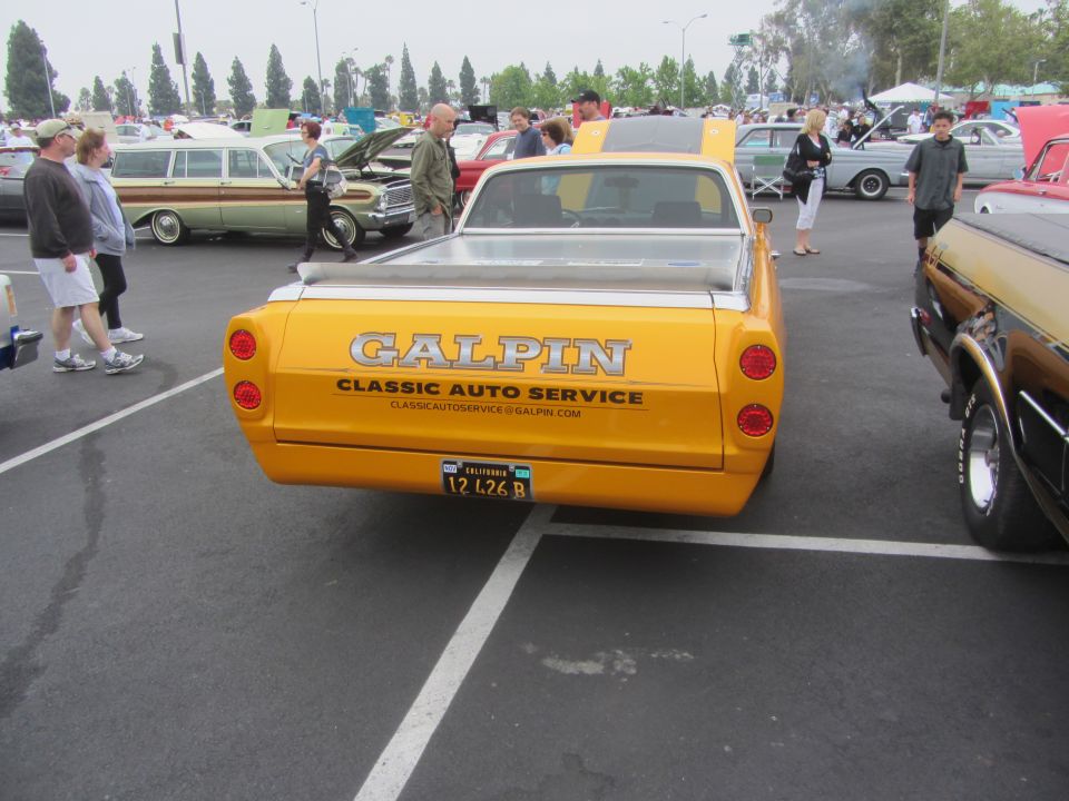 Yellow 1964 Ford Ranchero rear view with Galpin Classic Auto Service branding