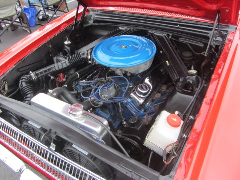 1964 Ford Ranchero - Engine bay of a 1964 Ford Ranchero, a blue air cleaner and chrome valve covers.
