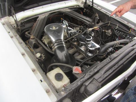 1964 Ford Ranchero - The engine bay of a 1964 Ford Ranchero, chrome valve covers and an aftermarket air intake system.