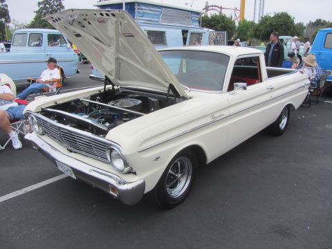 1964 Ford Ranchero - A classic white Ford Ranchero pickup truck is displayed with its hood open, parked outdoors.