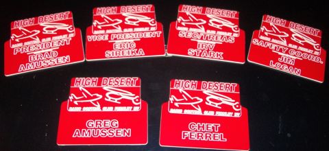 1996 Ford Bronco - Several red name tags display 'HIGH DESERT' and individual names and titles, including President and Vice President.