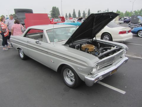 1964 Ford Ranchero - Silver 1964 Ford Falcon coupe on display at a car show, hood raised to reveal the engine bay.