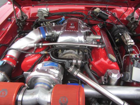 1964 Ford Ranchero - Custom engine bay features a polished supercharger and intake system with red accents.