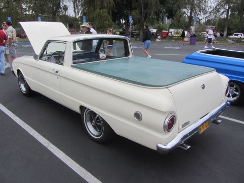 1964 Ford Ranchero - A 1963 Ford Falcon Ranchero is shown with its hood open, parked in a lot next to another vehicle.