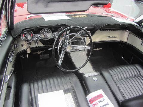 1964 Ford Ranchero - Dashboard and interior of a 1961 Ford Thunderbird convertible, with a newspaper on the passenger seat.