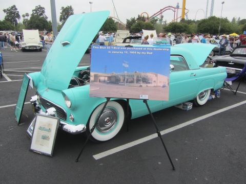 1964 Ford Ranchero - A turquoise 1955 Ford Thunderbird is displayed with a photo of its original dealership.