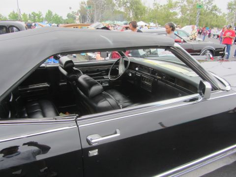 1964 Ford Ranchero - Interior view of a black convertible with a black soft top.