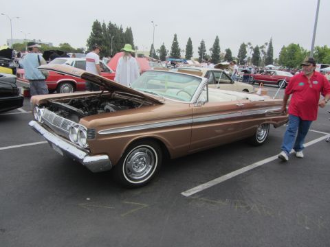 1964 Ford Ranchero - A brown 1964 Ford Falcon convertible is displayed with its hood open at a car show event.