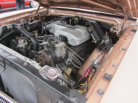 1964 Ford Ranchero - Close-up view of the engine compartment, showing various mechanical components and wiring harnesses.