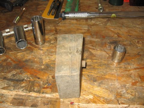 1995 Ford Bronco - This is the roughly 2.25" solid steel block that I removed. Took the dremel metal cutting wheel to the welds to extricate the wedge po…