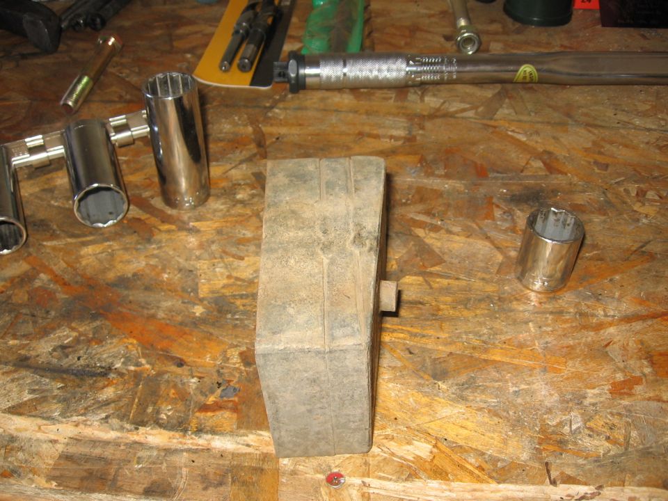 This is the roughly 2.25" solid steel block that I removed.  Took the dremel metal cutting wheel to the welds to extricate the wedge portion for reuse (vs. using the procomp aluminum wedge).