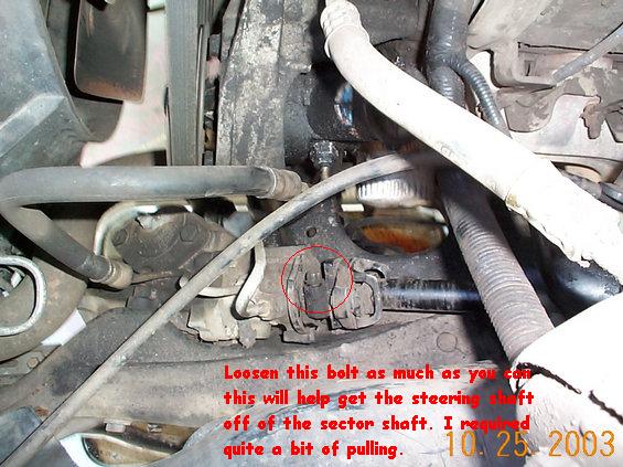 When removing the steering shaft from the sector shaft, it helps to have to sets of hands. The bolt holding the drive shaft on needs to be loosened as much as possible. Once is is loosened you should be able to pull it off.