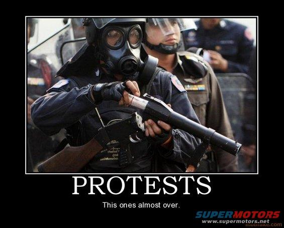 Meme of a riot police officer in a gas mask captioned PROTESTS