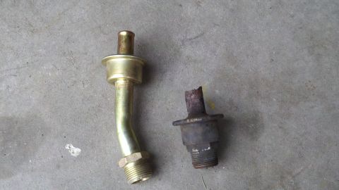 1978 Ford Bronco - Two metal pipe fittings are shown on a concrete surface, one intact and one broken.