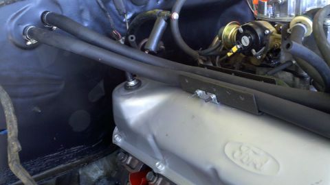 1978 Ford Bronco - Close-up view of an engine bay, focusing on a silver valve cover and black hoses. A watermark for Supermotors.net is visible in the lower r…