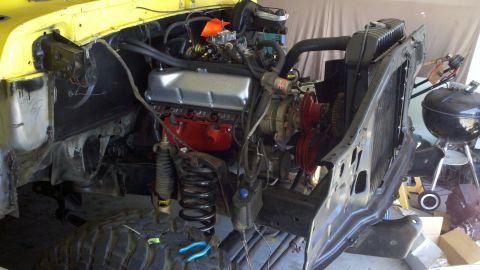 1978 Ford Bronco - Engine and chassis parts laid out for a motor rebuild project.