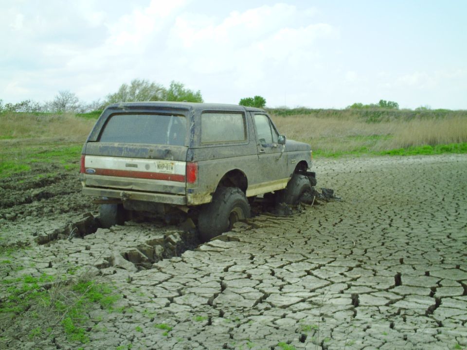 1990 Ford Bronco stuck in cracked mud