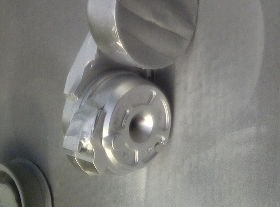 Idler tension pulley matte aluminum.
Taped off where the belt rides and the pulley itself. Also taped off the small black tab on the top