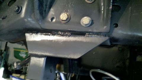 1995 Ford Bronco - Close-up view of a metal bracket attached to the vehicle's frame.