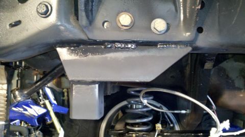 1995 Ford Bronco - Close-up view of the undercarriage, showing frame modifications and suspension components.