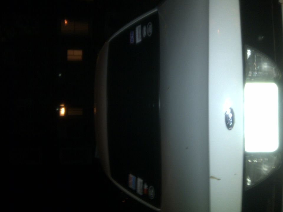White 2000 Ford Crown Victoria, front 3/4 view, with a Supermotors.net watermark