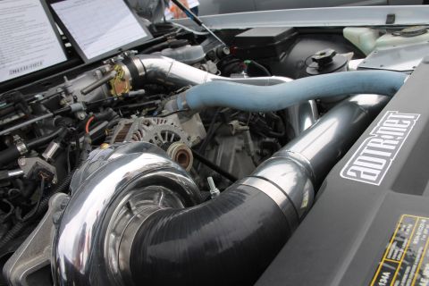 2004 Ford Crown Victoria - Custom turbocharged engine bay a prominent turbocharger and intercooler piping.