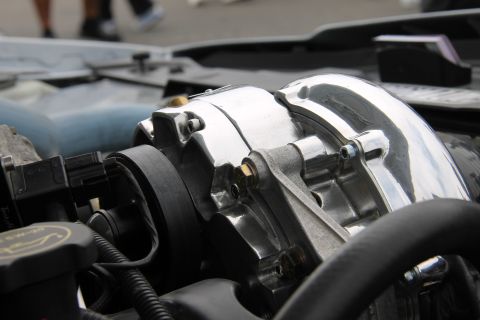 2004 Ford Crown Victoria - Close-up of a chrome supercharger assembly in a vehicle's engine bay.