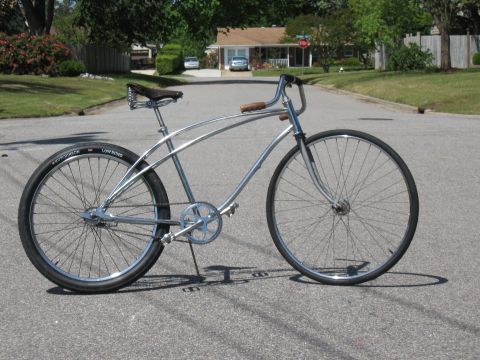 1994 Ford Bronco - A custom cruiser bicycle with chrome frame and wide tires is shown from the side.
