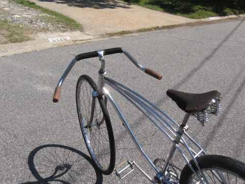 1994 Ford Bronco - This vintage bicycle has a chrome frame, sprung seat, and unique swept handlebars.
