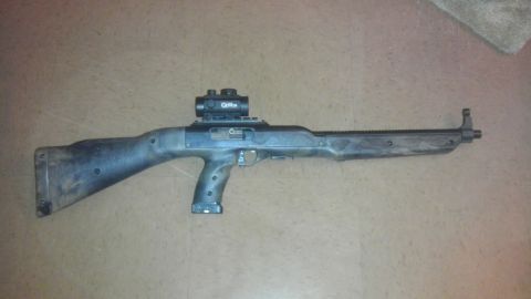 2000 Mercury Grand Marquis - A Hi-Point 995 Carbine with a red dot sight is displayed on a floor.