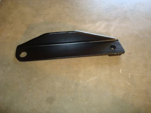 1995 Ford Bronco - A single black metal bracket, likely a vehicle part, is shown against a concrete background.