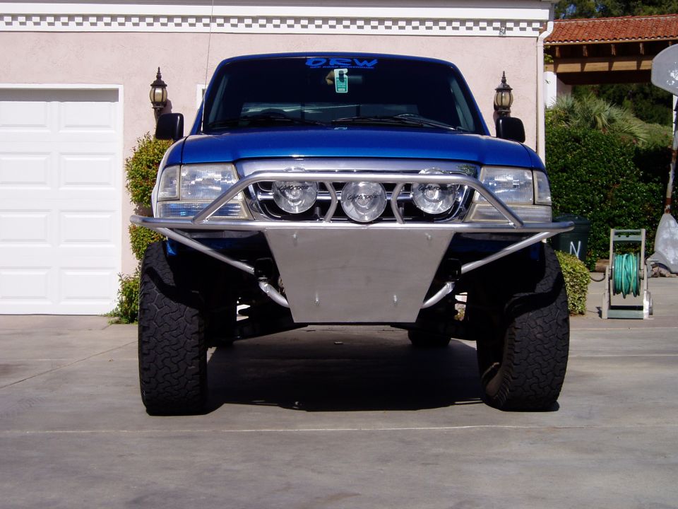 Blue 1998 Ford Ranger front view with custom bumper and off-road tires