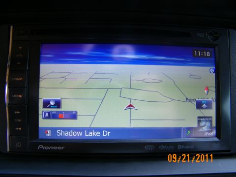 2003 Ford Crown Victoria - Pioneer touchscreen GPS map view with HD Radio, Bluetooth and DVD labels along bottom bezel