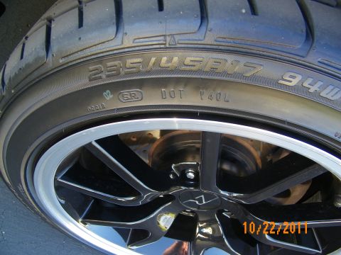 2003 Ford Crown Victoria - Tire sidewall marked 255/45R17 94W mounted on a black wheel with machined lip.