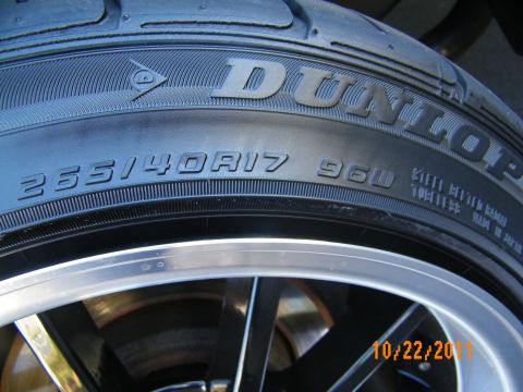 2003 Ford Crown Victoria - Close-up of a Dunlop sidewall marked 255/40R17 96W on a machined-lip black wheel.