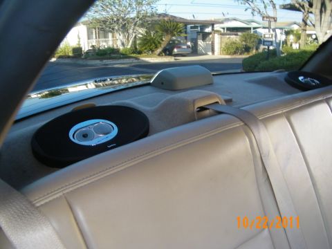 2003 Ford Crown Victoria - Rear parcel shelf holding an Infinity speaker above tan rear seating